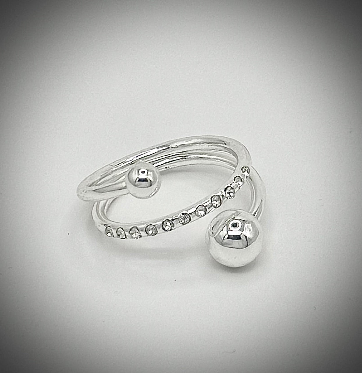 silver tone adjustable ring with crystal accents