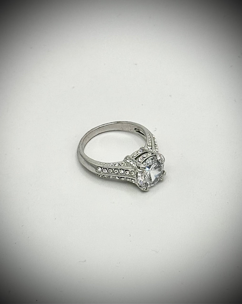 silver tone engagement style ring