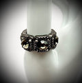 gunmetal tone statement style stretch ring with black glass size 7.5-11.5